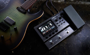 BOSS GX-10 compact amp/effects processor placed next to guitar