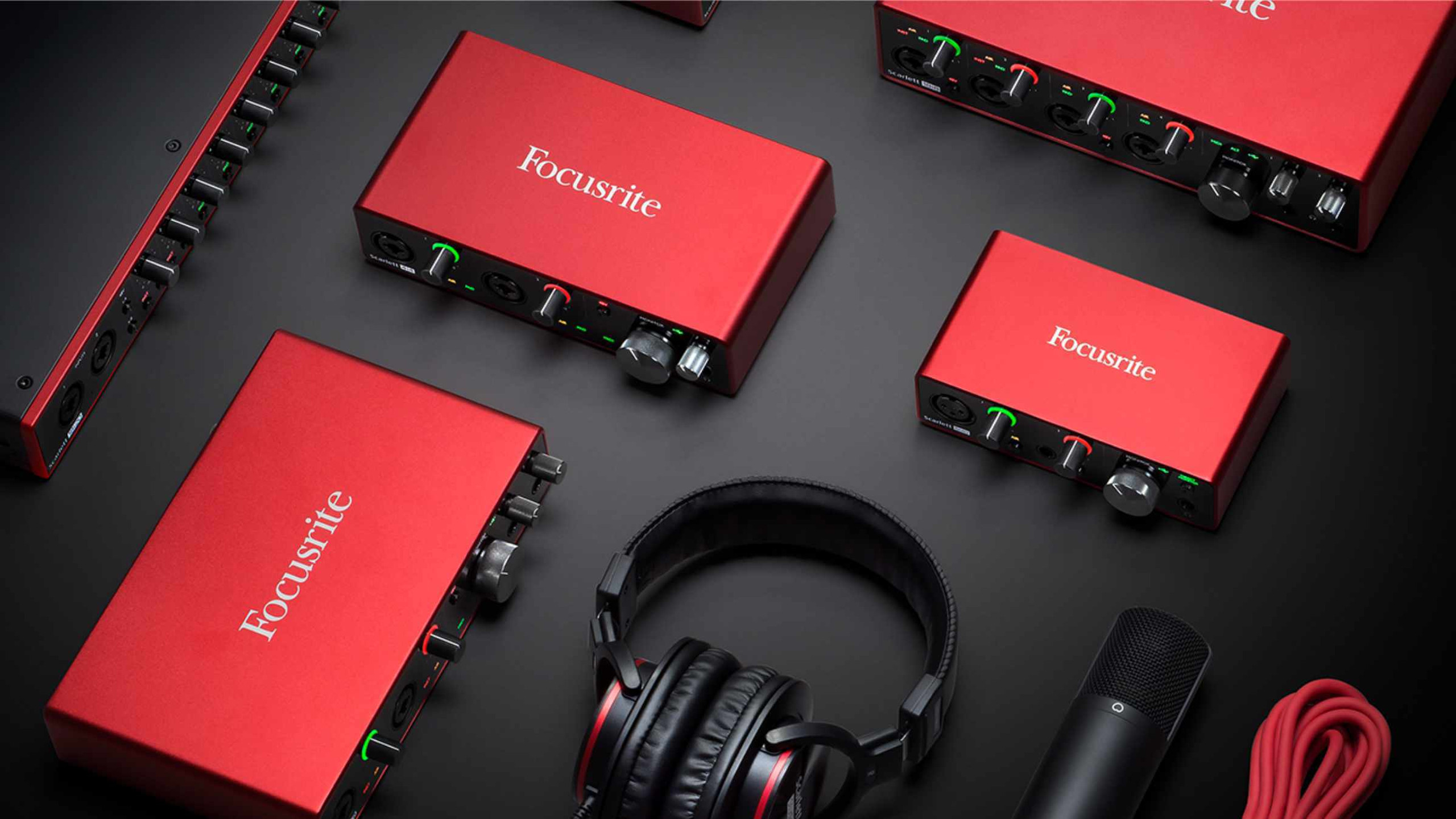 Focusrite USB audio enclosures sitting on a black surface